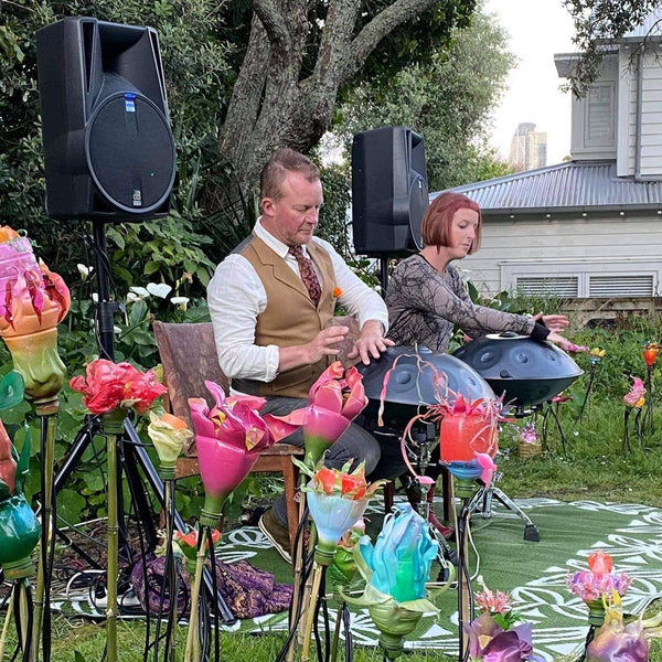 Handpan duo in garden playing live