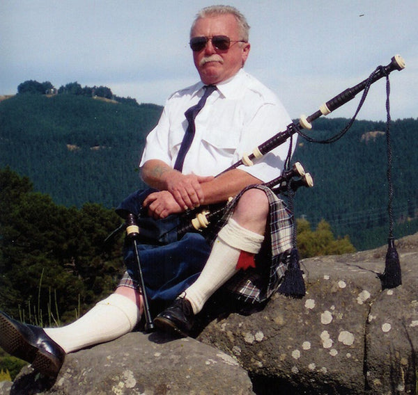Dunedin piper Bill Swift with his pipes