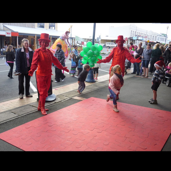 Free Lunch Hamilton red characters with kids at event