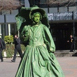 Free Lunch Pioneer woman in green living statue
