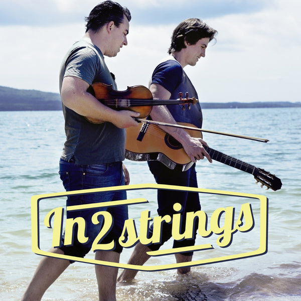 Auckland guitar and violin duo walking on the beach