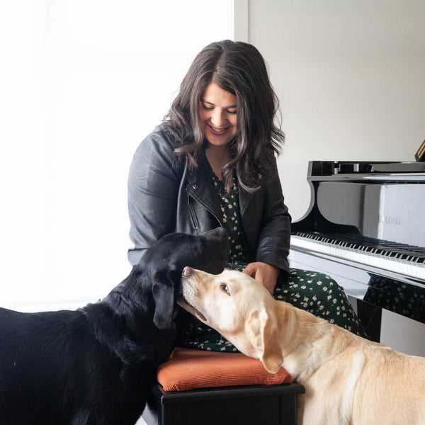 Natalie Meszaros and 2 dogs at the piano
