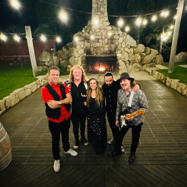 Monroes covers band Hamilton group shot outside