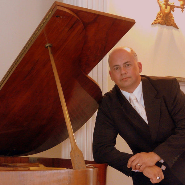 Andre Mendes da Costa Wellington pianist at the piano