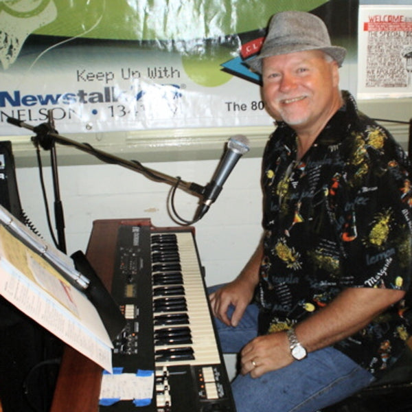 Barry Korcheski singing and playing keyboard live