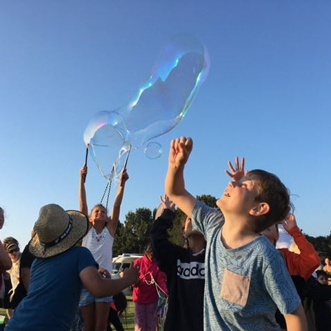 Giant bubbles children having fun