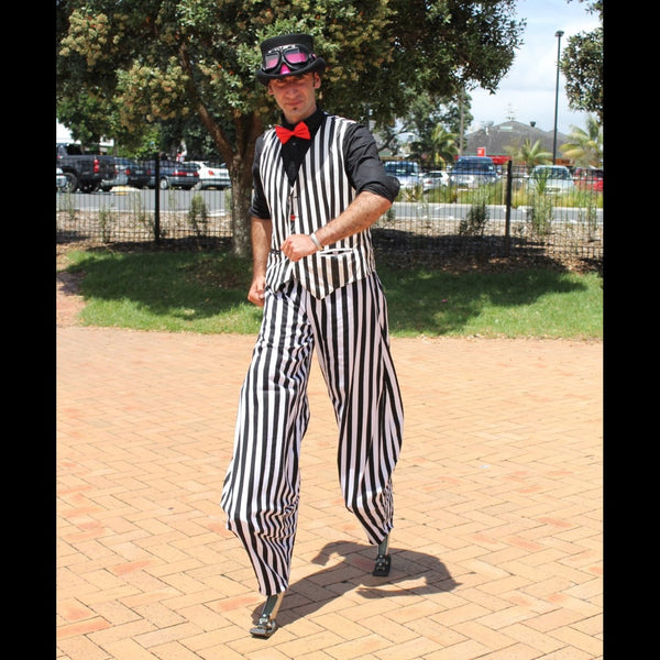 Man on stilts in stripes Tauranga