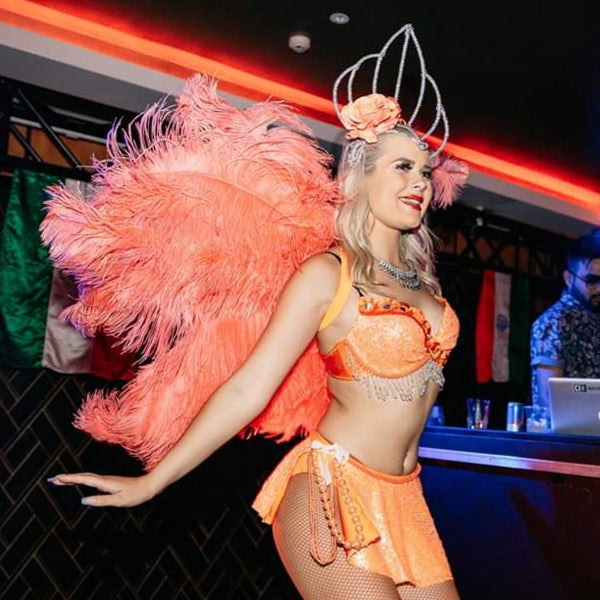 Boa feathers in orange Auckland dance group Finesse Entertainment