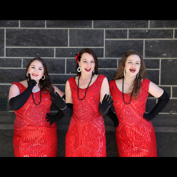 Foxy Tones 3 female singers dressed in red