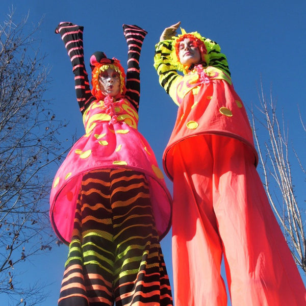 Free Lunch Hamilton stilt walkers in pink stripes