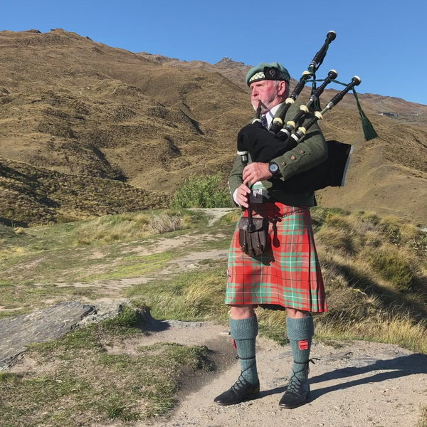 Graeme Glass in the Central Otago hillside - Bagpiper Queenstown